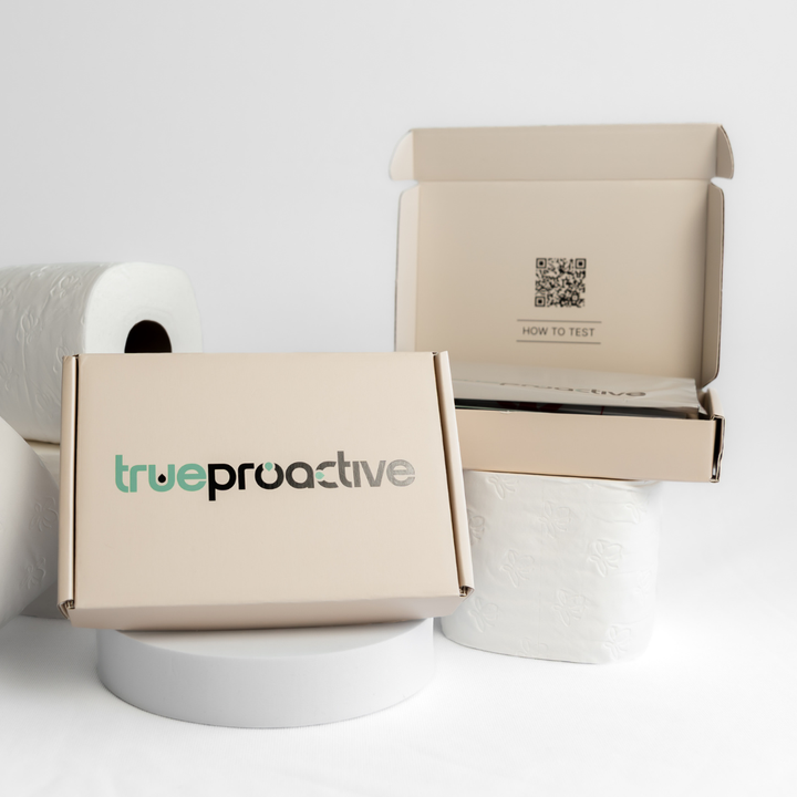 Two True Proactive bowel cancer screening FIT Tests, one package open, one closed, product packaging on a white background